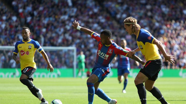 Jordan Ayew holds off a challenge from Jannik Vestergaard