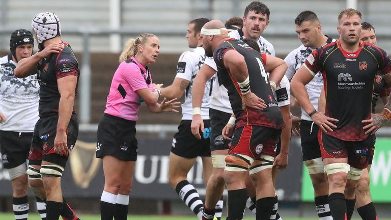 Referee Joy Neville talks to Dragon's Rynard Landman.

