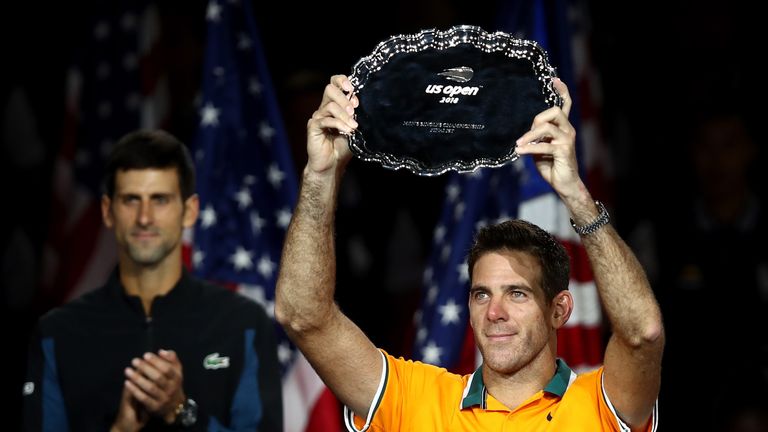 Juan Martin del Potro of Argentina poses with the runner-up trophy after losing his men's Singles finals match against Novak Djokovic of Serbia on Day Fourteen of the 2018 US Open
