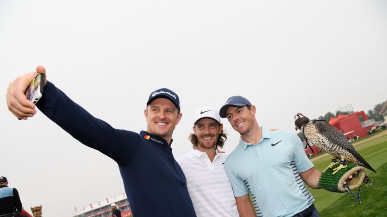 ABU DHABI, UNITED ARAB EMIRATES - JANUARY 16:  (L-R)  Justin Rose of England, Tommy Fleetwood of England and Rory McIlroy of Northern Ireland take part in a photocall for the Abu Dhabi HSBC Golf Championship at Abu Dhabi Golf Club on January 16, 2018 in Abu Dhabi, United Arab Emirates.  (Photo by Ross Kinnaird/Getty Images)