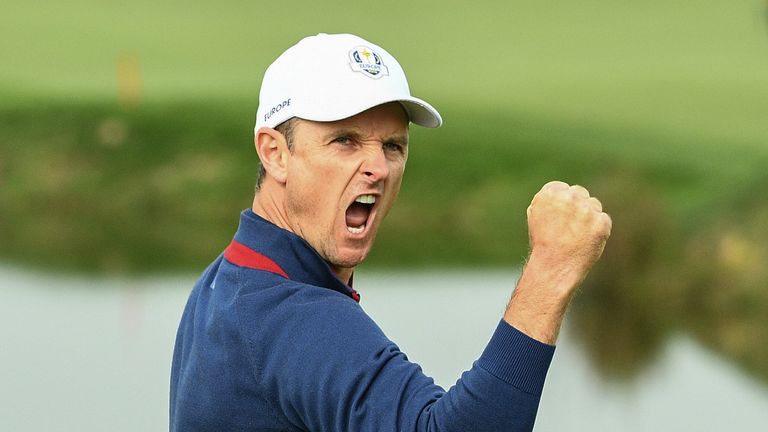 Justin Rose reacts after making a putt during his fourball match on the first day of the 42nd Ryder Cup at Le Golf National Course at Saint-Quentin-en-Yvelines, south-west of Paris