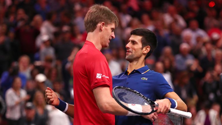 Team World Kevin Anderson of South Africa hugs Team Europe Novak Djokovic of Serbia after defeating him in their Men's Singles match on day two of the 2018 Laver Cup at the United Center on September 22, 2018 in Chicago, Illinois.