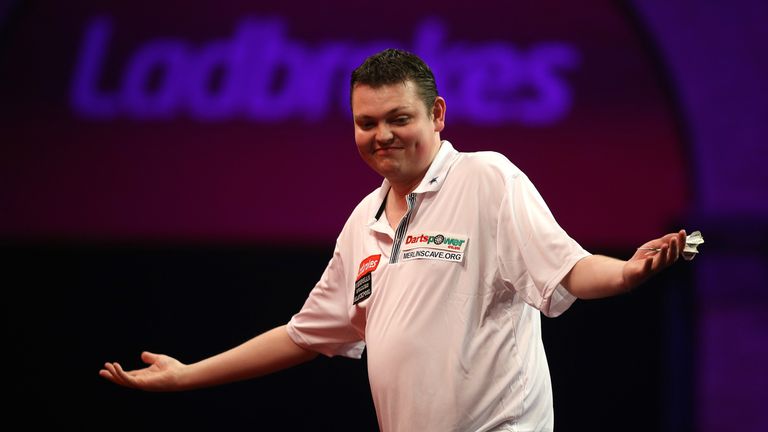 Kevin McDine of England celebrates after winning his first round match against Wayne Jones of England during the Ladbrokes.com World Darts Championship on Day Two at Alexandra Palace on December 14, 2013 in London, England