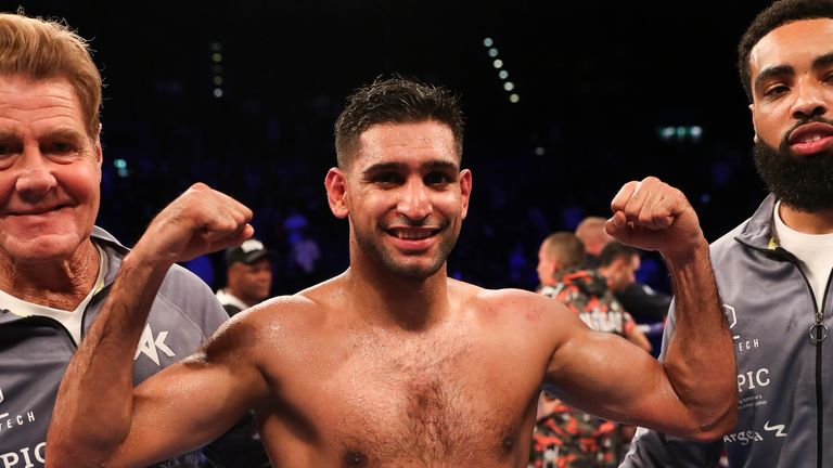 Khan celebrates his win back at welterweight