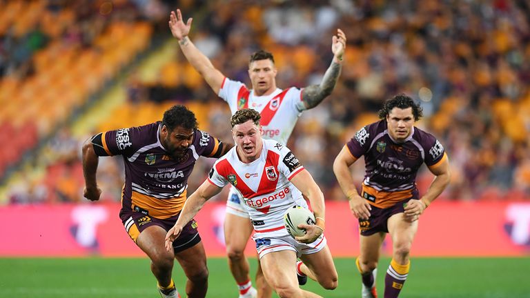  Kurt Mann of the Dragons breaks through the Broncos defence