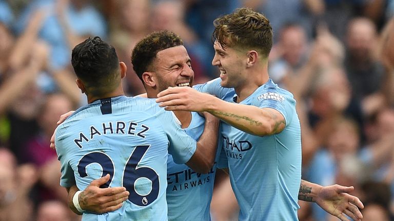 Kyle Walker celebrates his goal with Riyad Mahrez and John Stones