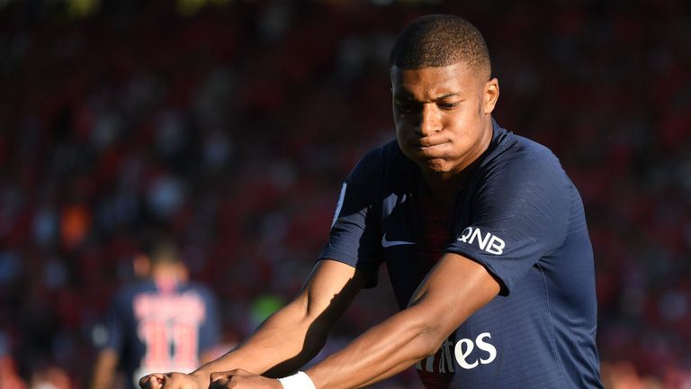 Paris Saint-Germain's French forward Kylian Mbappe celebrates after scoring their third goal during the French L1 football match between Nimes and Paris Saint-Germain (PSG), on September 1, 2018 at the Costieres stadium in Nimes, southern France. (Photo by Pascal GUYOT / AFP)        (Photo credit should read PASCAL GUYOT/AFP/Getty Images)