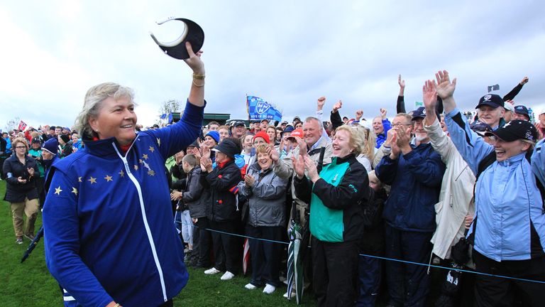 Laura Davies celebrates with the crowd as team Europe wins the Solheim Cup in 2011