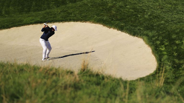 Brooks Koepka plays out of a bunker on the 12th at Le Golf National during practise