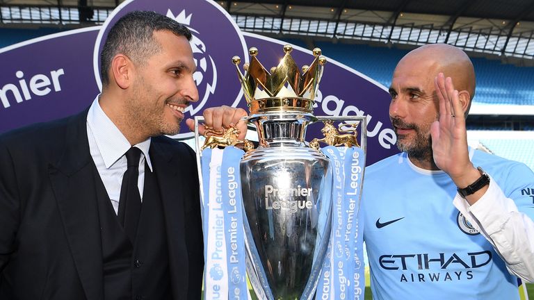 Khaldoon al-Mubarak, Manchester City chairman and Josep Guardiola, Manager of Manchester City pose with the Premier League trophy as Manchester City win the Premier League after the Premier League match between Manchester City and Huddersfield Town at Etihad Stadium on May 6, 2018 in Manchester, England.