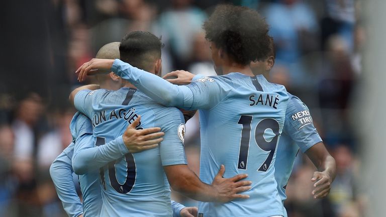 Manchester City players celebrate following their 3-0 win against Fulham in the Premier League.