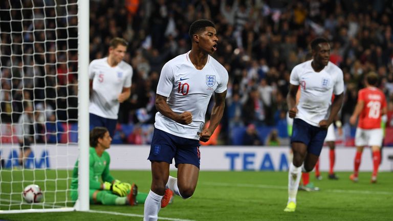 Marcus Rashford celebrates after scoring for England against Switzerland