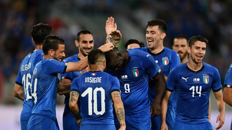 Mario Balotelli is mobbed by his team-mates after his goal 