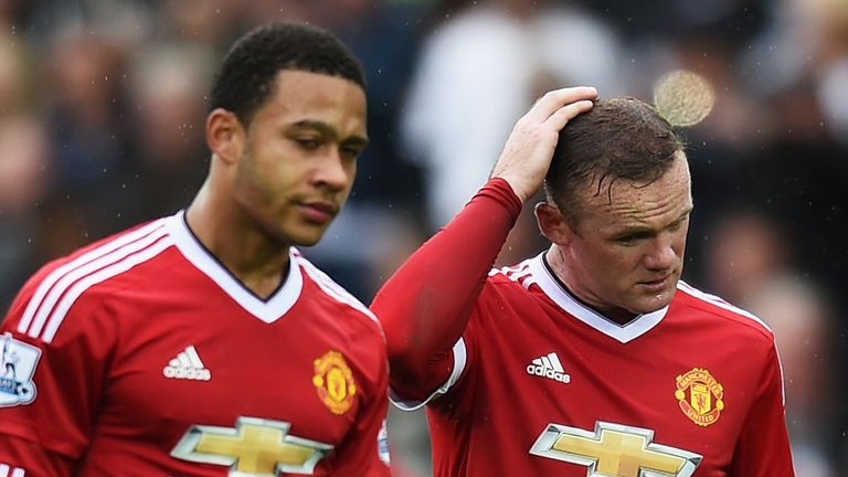 Wayne Rooney of Manchester United looks dejected with Memphis Depay after the Barclays Premier League match between Swansea City and Manchester United at Liberty Stadium on August 30, 2015 in Swansea, Wales.
