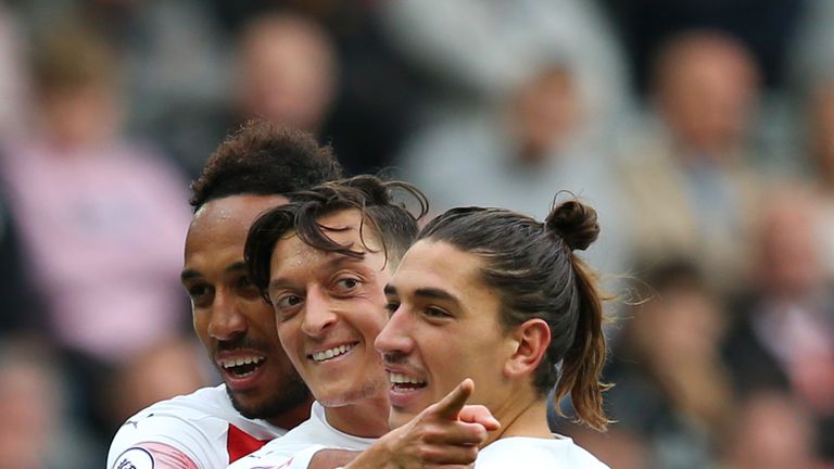 Mesut Ozil celebrates scoring for Arsenal against Newcastle