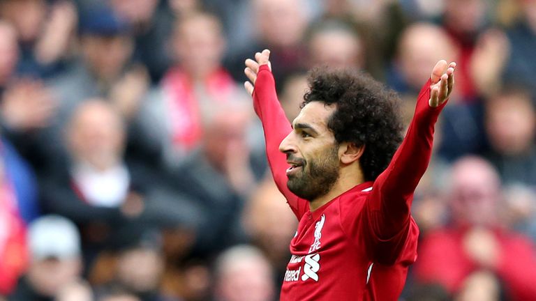 Mohamed Salah celebrates after scoring Liverpool&#39;s third goal