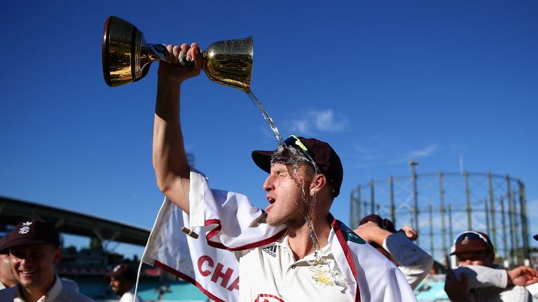Morne Morkel of Surrey pours champagne over his face with the Specsavers County Championship Division One Cup during Day Four of the Specsavers County Championship Division One match between Surrey and Essex at The Kia Oval on September 27, 2018 in London, England.  (Photo by Jordan Mansfield/Getty Images)