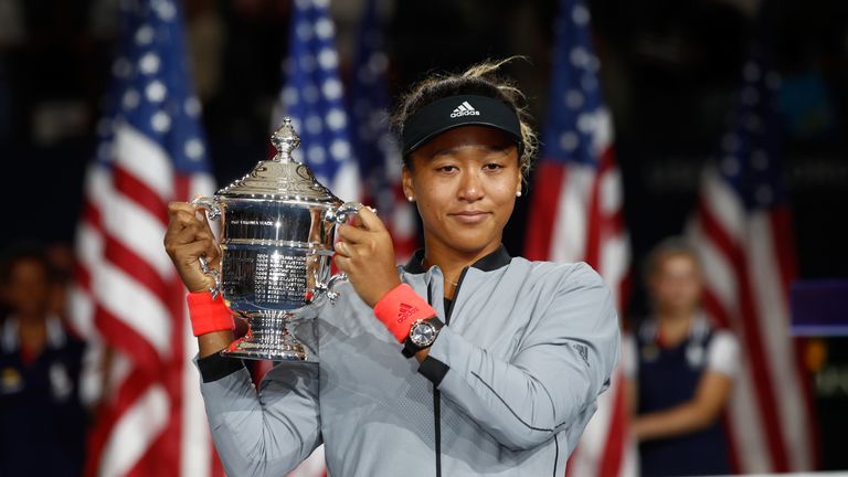 Naomi Osaka of Japan poses with the championship trophy after winning the Women's Singles finals match against Serena Williams of the United States on Day Thirteen of the 2018 US Open at the USTA Billie Jean King National Tennis Center on September 8, 2018 in the Flushing neighborhood of the Queens borough of New York City. 