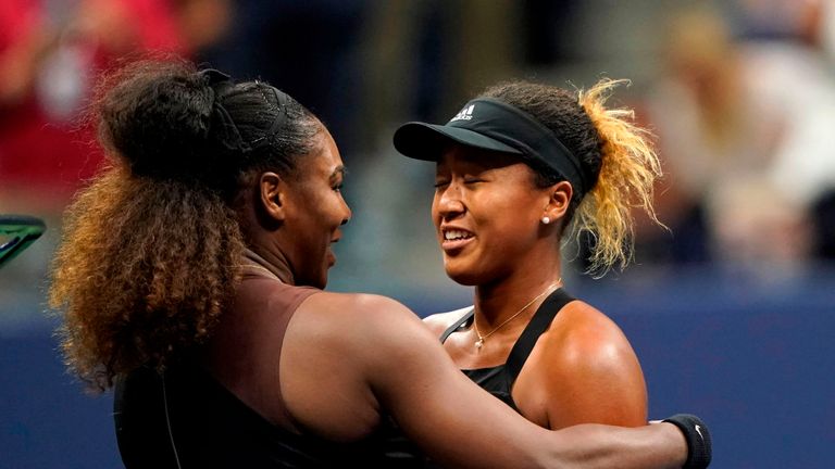 Naomi Osaka of Japan (R) and Serena Williams of the US meet at the net after their 2018 US Open women's singles final match on September 8, 2018 in New York. - Osaka, 20, triumphed 6-2, 6-4 in the match marred by Williams's second set outburst, the American enraged by umpire Carlos Ramos's warning for receiving coaching from her box.