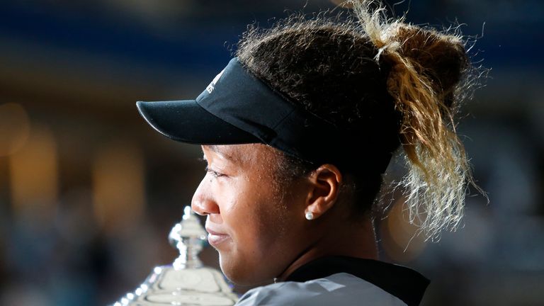 Naomi Osaka of Japan holds the trophy after her victory over Serena Williams of the US during their 2018 US Open women's singles final match on September 8, 2018 in New York.