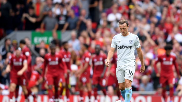 Mark Noble looks dejected after West Ham concede against Liverpool