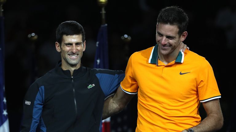 Novak Djokovic of Serbia poses with Juan Martin del Potro of Argentina after winning his men's Singles finals match on Day Fourteen of the 2018 US Open