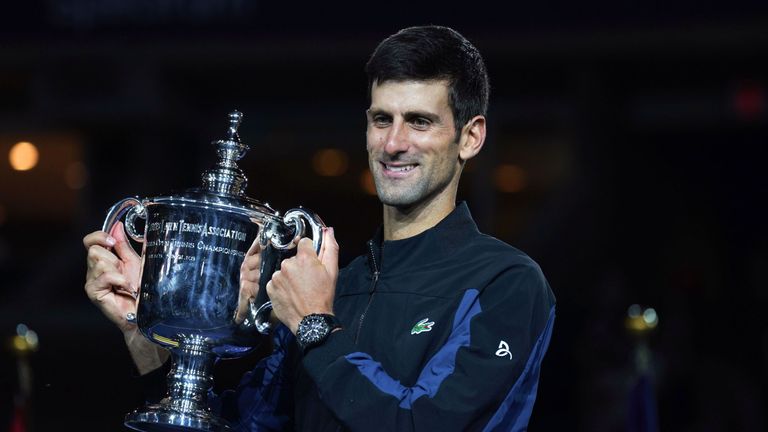 Novak Djokovic of Serbia poses with the championship trophy after winning his men's Singles finals match against Juan Martin del Potro of Argentina on Day Fourteen of the 2018 US Open 