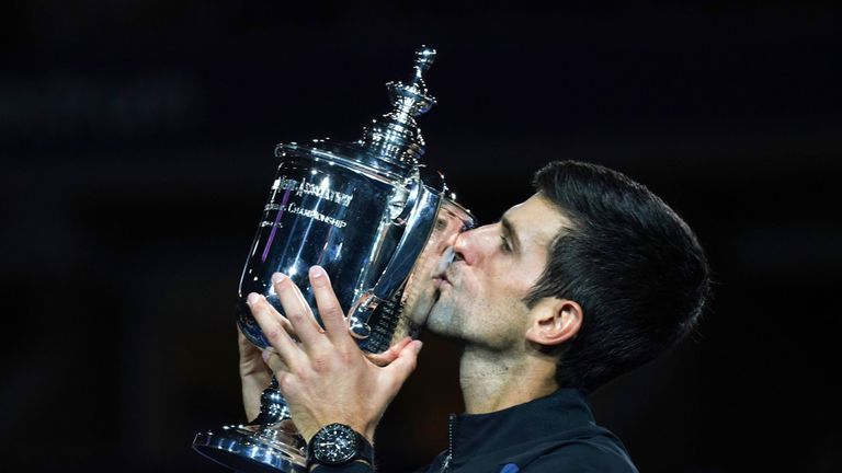 Serbia's Novak Djokovic kisses the trophy after winning against Argentina's Juan Martin del Potro during their Men's Singles Finals match at the 2018 US Open at the USTA Billie Jean King National Tennis Center in New York on September 9,2018. 