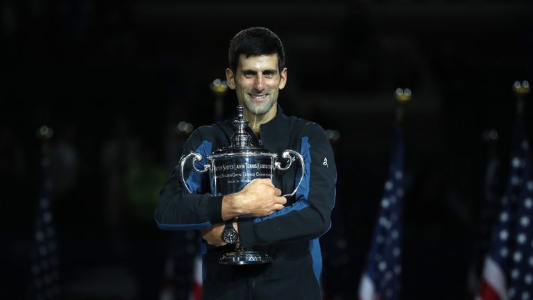 Novak Djokovic of Serbia poses with the championship trophy after winning his men&#39;s Singles finals match against Juan Martin del Potro of Argentina on Day Fourteen of the 2018 US Open 