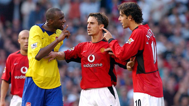 Gary Neville holds Patrick Vieira and Ruud van Nistelrooy apart prior to Vieira being sent off.             ..Manchester United v Arsenal, Old Trafford, Manchester, 21/9/03, Barclaycard Premiership...200 single usage fee, not to be syndicated or archived.