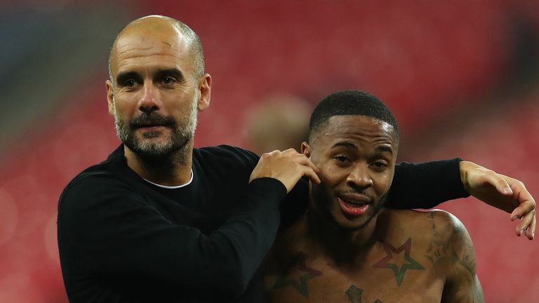 Josep Guardiola, Manager of Manchester City celebrates victory with Raheem Sterling of Manchester City after the Premier League match between Tottenham Hotspur and Manchester City at Wembley Stadium on April 14, 2018 in London, England. 