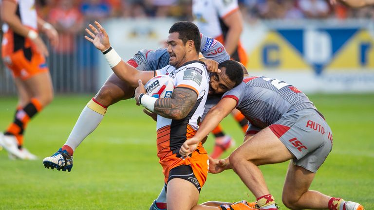 Castleford's Peter Matautia is tackled by Catalans Samisoni Langi & Benjamin Julien.