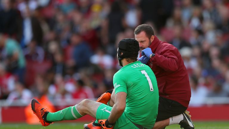 Petr Cech receives treatment prior to being substituted