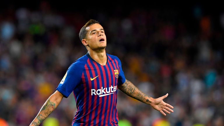 Barcelona's Brazilian midfielder Philippe Coutinho celebrates after scoring a goal during the Spanish league football match between Barcelona and Alaves at the Camp Nou stadium in Barcelona on August 18, 2018