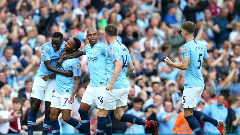 Raheem Sterling is congratulated by teammates Benjamin Mendy and Fernandinho