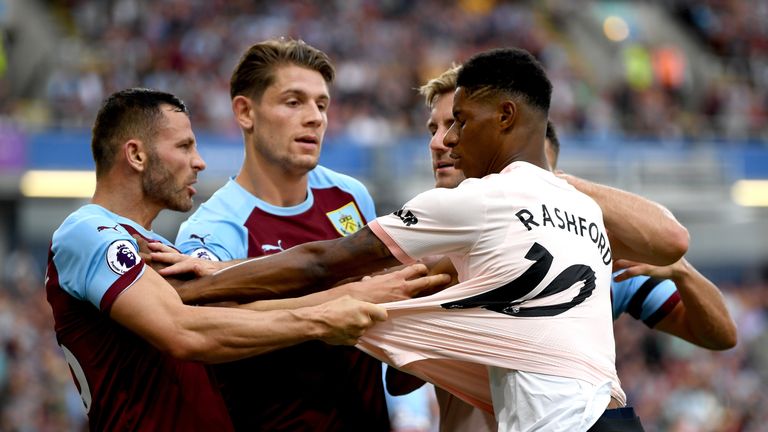 Marcus Rashford and Phil Bardsley square up during the Premier League match between Burnley FC and Manchester United at Turf Moor on September 2, 2018 in Burnley, United Kingdom.