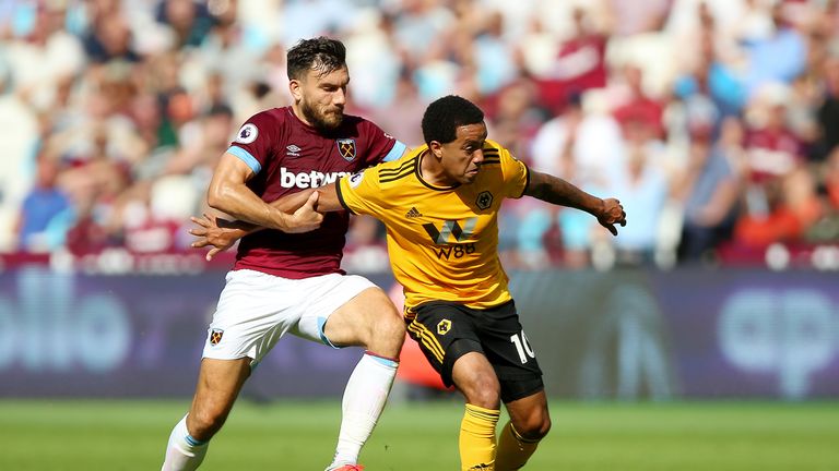 Robert Snodgrass and Helder Costa battle for the ball