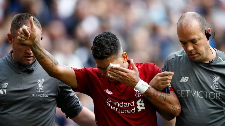   Firmino was helped from the field. after an eye injury against Tottenham 