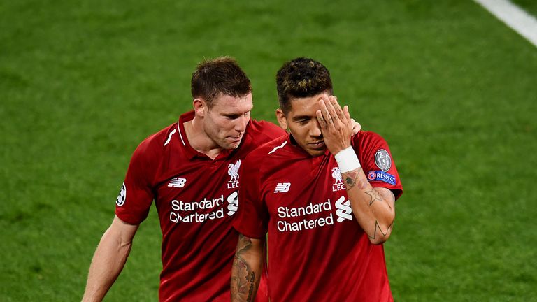 Roberto Firmino celebrates after scoring against PSG by covering the eye he injured against Tottenham