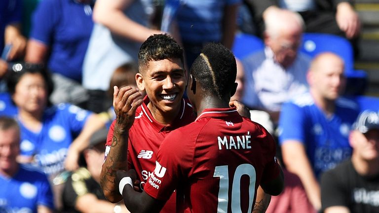 Roberto Firmino celebrates with Sadio Mane after doubling Liverpool's lead