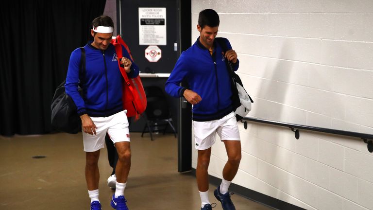 Team Europe Roger Federer of Switzerland and Team Europe Novak Djokovic of Serbia talk prior to their Men's Doubles match against Team World Kevin Anderson of South Africa and Team World Jack Sock of the United States on day one of the 2018 Laver Cup at the United Center on September 21, 2018 in Chicago, Illinois.