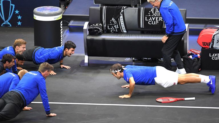 Team Europe Roger Federer of Switzerland celebrates with his teammates by doing push-ups after defeating Team World John Isner of the United States in their Men's Singles match on day three of the 2018 Laver Cup at the United Center on September 23, 2018 in Chicago, Illinois