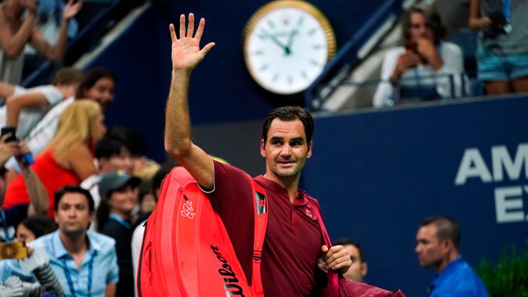 Switzerland's Roger Federer waves as he walks off court after losing his 2018 US Open Men's Singles tennis match against Australia's John Millman at the USTA Billie Jean King National Tennis Center in New York on September 3, 2018. 