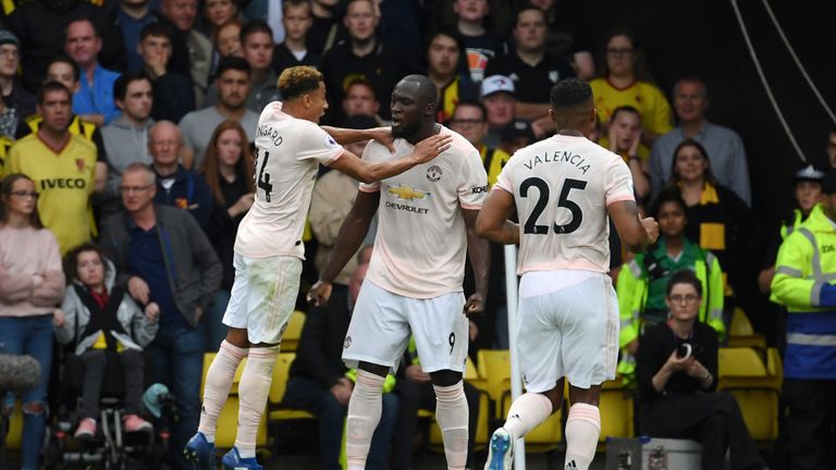  Romelu Lukaku of Manchester United celebrates after scoring his team's first goal with Jesse Lingard of Manchester United during the Premier League match between Watford FC and Manchester United at Vicarage Road on September 15, 2018 in Watford, United Kingdom