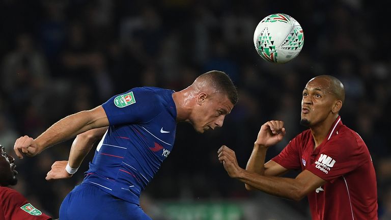 Chelsea's English midfielder Ross Barkley (L) vies with Liverpool's Brazilian midfielder Fabinho during the English League Cup third round football match between Liverpool and Chelsea at Anfield in Liverpool, north west England on September 26, 2018. (Photo by Paul ELLIS / AFP) / RESTRICTED TO EDITORIAL USE. No use with unauthorized audio, video, data, fixture lists, club/league logos or 'live' services. Online in-match use limited to 120 images. An additional 40 images may be used in extra time. No video emulation. Social media in-match use limited to 120 images. An additional 40 images may be used in extra time. No use in betting publications, games or single club/league/player publications. /         (Photo credit should read PAUL ELLIS/AFP/Getty Images)