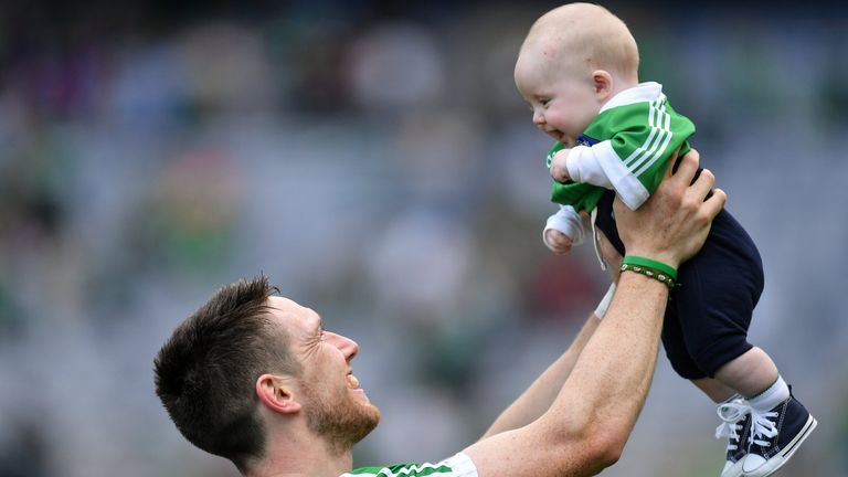 Hickey of Limerick celebrates with his son Patrick after the All-Ireland final