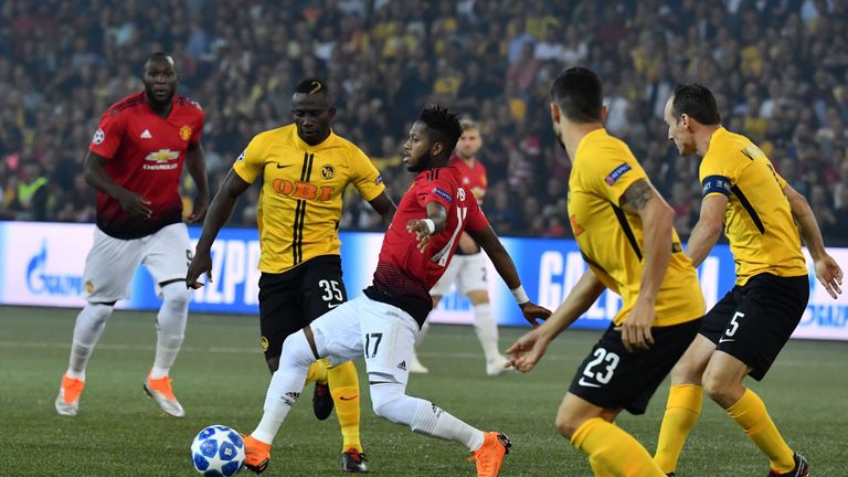 Young Boys Ivorian midfielder Sékou Sanogo (C) controls the ball past Manchester United's Brazilian midfielder Fred (C/R) during the UEFA Champions League group H football match between Young Boys and Manchester United at The Stade de Suisse in Bern on September 19, 2018. 