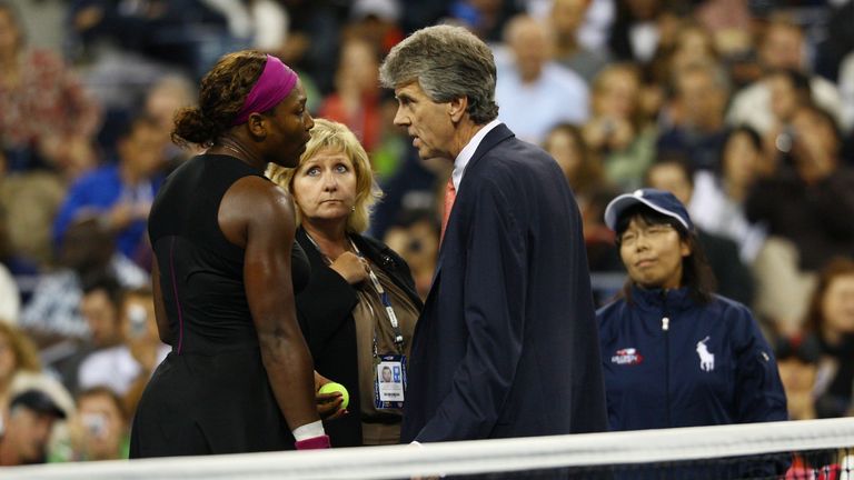 Serena Williams (L) argues with Brian Early (R) and Donna Kelso (C) after disqualified for a default during the Women's Singles Semifinal match against to Kim Clijsters of Belgium on day thirteen of the 2009 U.S. Open