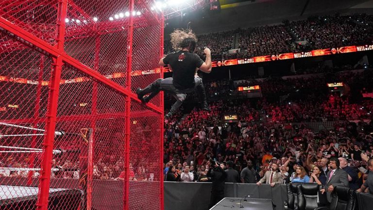 rollins and ziggler send each other flying off cell into tables