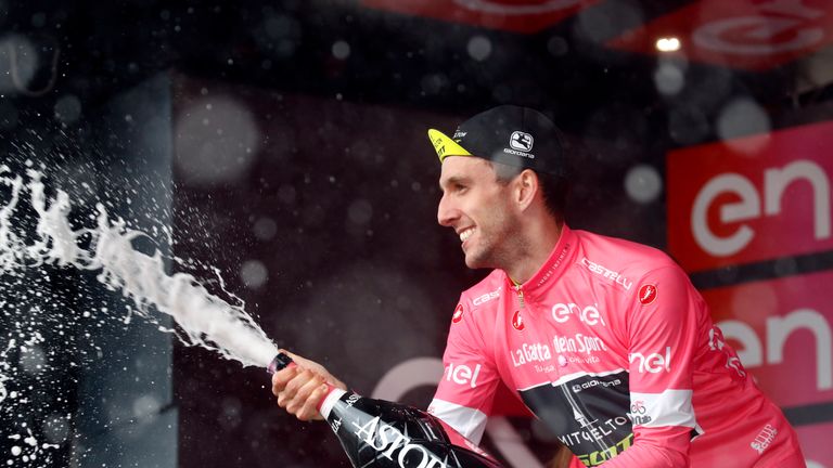 Simon Yates celebrates with champagne at La Vuelta